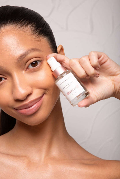 Model holding Hydrating Eye Serum with peptides aloe and cucumber