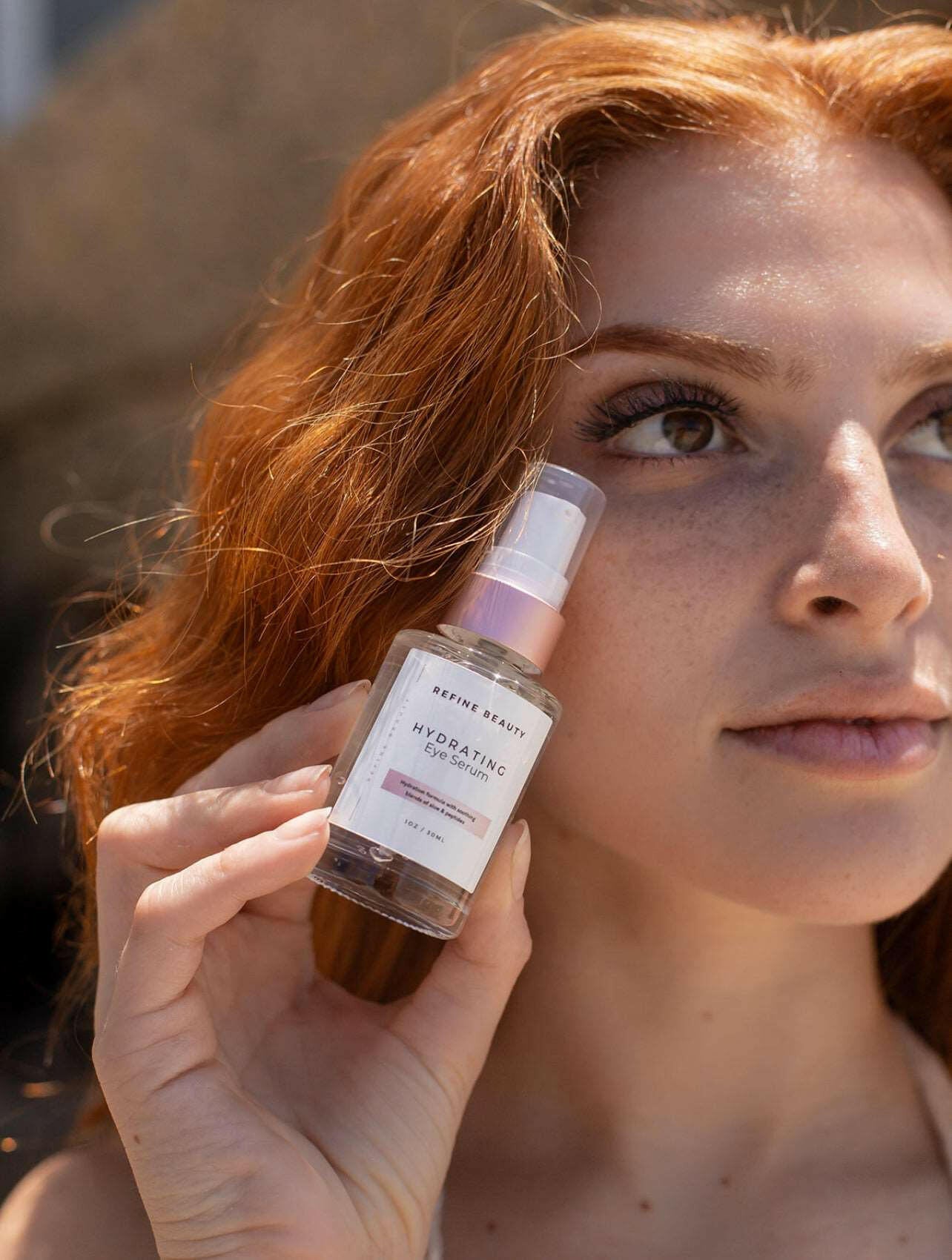 Model holding Hydrating Eye Serum